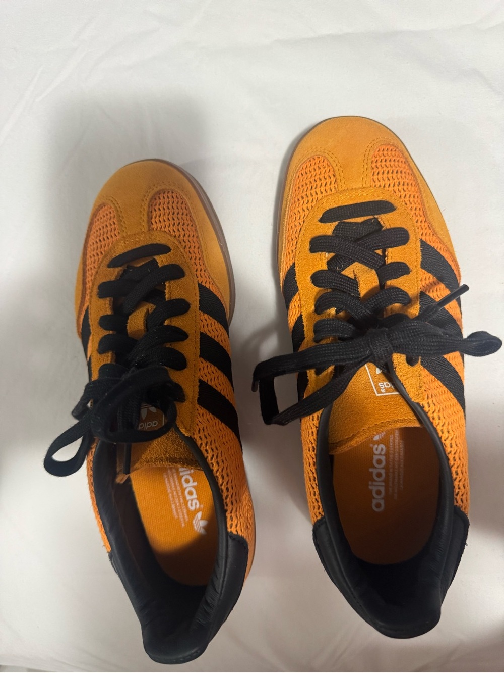 adidas women Orange and Black Slip-On Sneaker